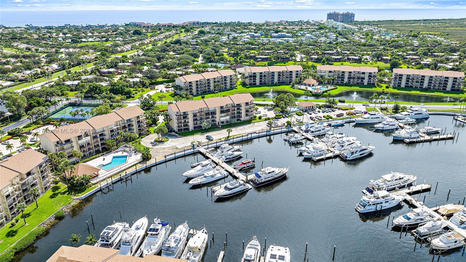 Nestled directly on the Intracoastal Waterway & surrounded by stunning multi-million-dollar waterfront estates, this exceptional property offers the luxury lifestyle you've always dreamed of—without the hefty price tag. Relax & unwind on your expansive patio as yachts glide by & take in the breathtaking panoramic views from this fully renovated 2-bedroom, 2-bathroom home with a bonus room featuring a Murphy bed. Every detail of this property has been thoughtfully updated with impact glass throughout, beautiful flooring, sleek stainless-steel appliances, & elegant granite countertops. The screened-in patio offers a perfect spot to enjoy the outdoors year-round.