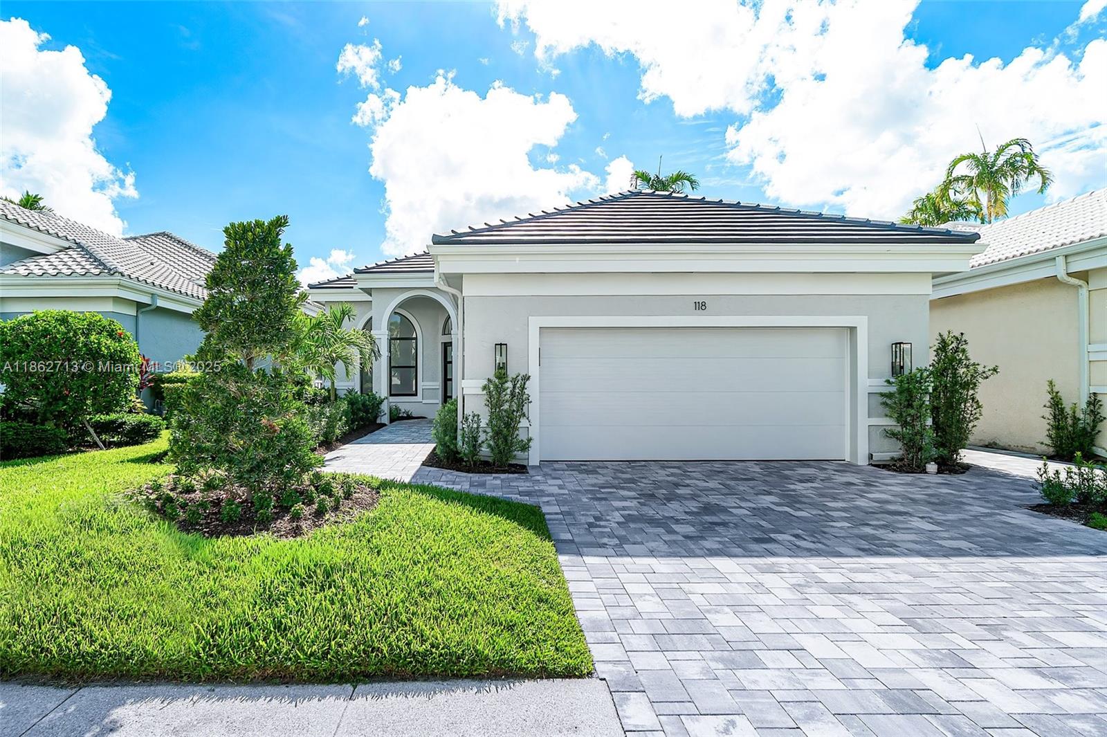 Words can't describe this home! A rarely available, fully renovated gem in the highly sough-after Ballenisles Country Club. Perfectly situated on a quiet street just minutes from the clubhouse, this turnkey residence showcases breathtaking lake views, an open and airy floor plan, and a show-stopping chef's kitchen with a waterfall island & bar, brand-new Thermador appliances, and sleek large-format tile. Step outside to your luxury resort-style newly renovated pool featuring an expansive marble pool deck, and all-new pool equipment-perfect for entertaining or simply soaking up the florida sunshine. Additional features include golf cart garage, impact windows, built-out closets, new driveway, epoxy garage floors and more. Offered with Sports membership.