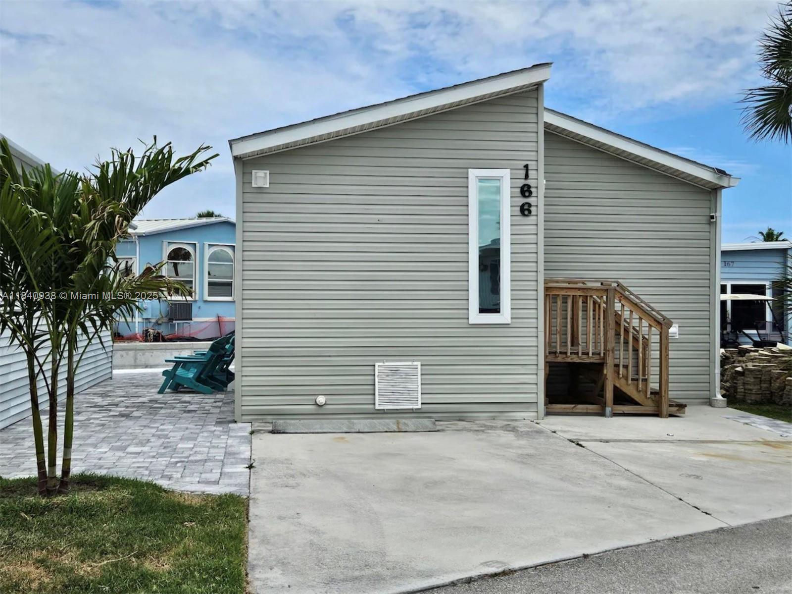 Dockside home with two bedrooms and one & a half bathrooms. Enjoy an open concept kitchen and living area - all furniture and appliances included in the sale! Recently paved area and stairs, as well as a recently done seawall! Easy to Show.