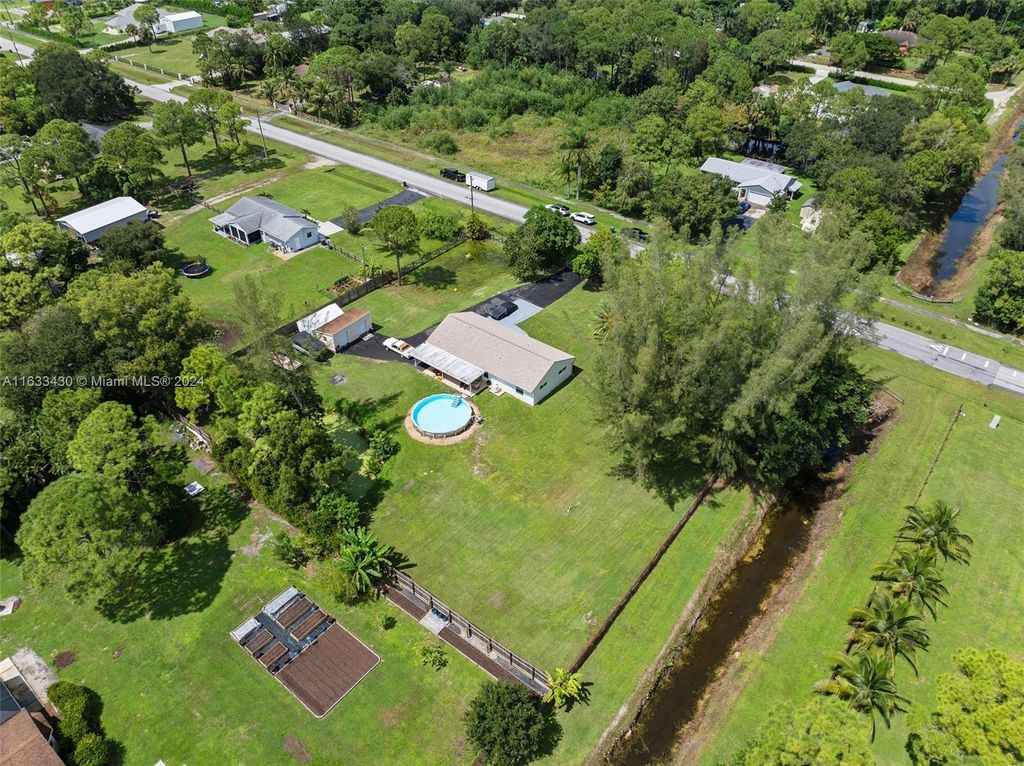 Photo of 14754 Citrus Grove Blvd, Loxahatchee, FL 33470 (MLS # A11633430)