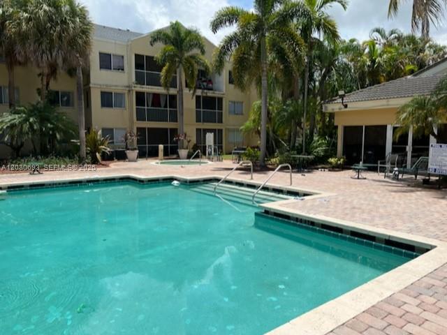 Photo of 5612 Rock Island Rd #154, Tamarac, FL 33319 (MLS # A12030693)