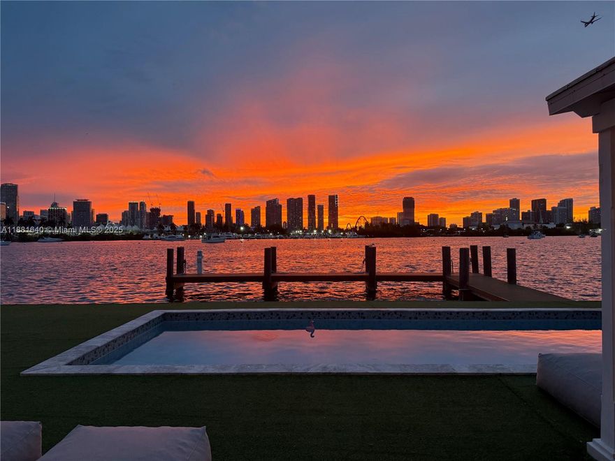 Bring your boat and live the ultimate Miami Beach lifestyle on the exclusive, guard-gated Palm Island. 4 beds, 4.5 baths, stunning panoramic views and over 3,000 sq ft of indoor living space. Floor-to-ceiling windows, breathtaking views of Biscayne Bay and the Miami skyline. Spacious kitchen, sleek cabinetry, and a large island perfect for entertaining. The large primary suite includes a private terrace, spa-like bathroom, and walk-in closets. The 4th bed is currently a media room but can be a bedroom. Outdoors, enjoy resort-style living with a heated pool, summer kitchen and 78 feet on the water, private dock. Mins from South Beach, Brickell, Downtown, Airport and all major roads. This home offers privacy, security, and convenience in one of Miami’s most sought-after neighborhoods.