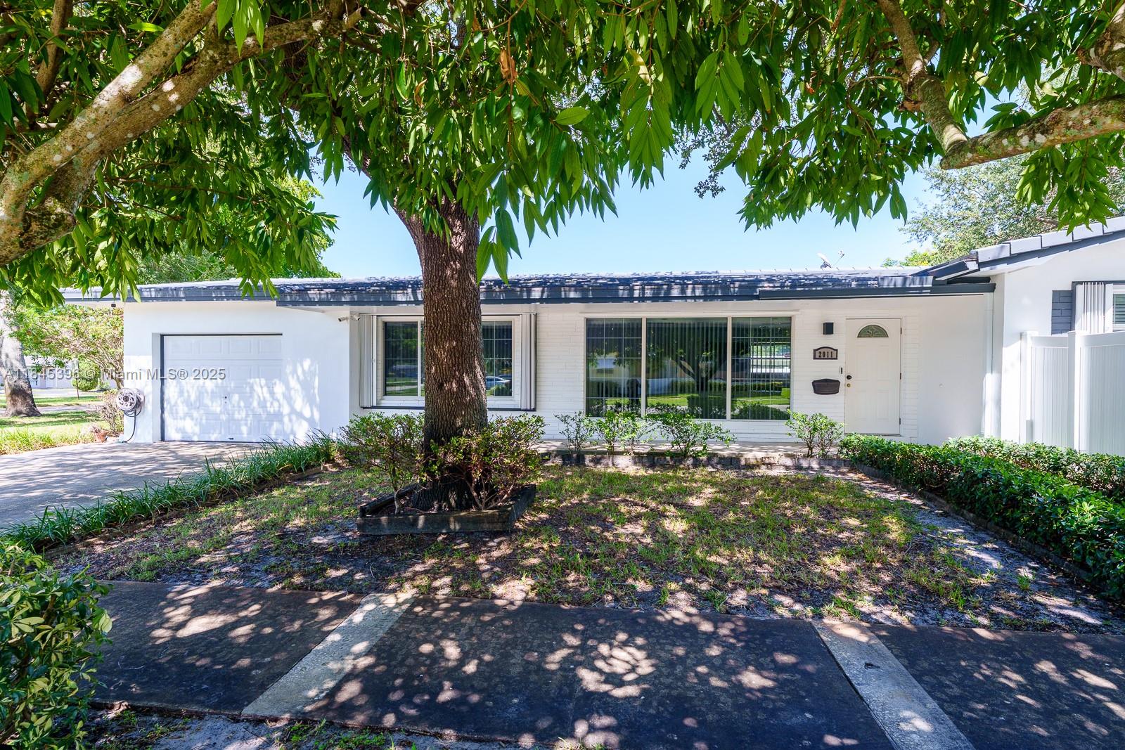 BEAUTIFUL TREES WELCOME YOU TO THIS GREAT HOME, ! UNIQUE FLOOR PLAN CAN EASILY BE 4 BEDROOMS, SITUATED ON A LARGE CORNER WITH TONS OF PARKING FOR BOAT AND RV! Beautiful tree-lined front yard, welcoming patio for morning coffee; this house is immaculate! 3 beds + Den or office, 2 baths, spacious garage, lots of closets and large primary suite & bath. SS appliances, eat-in kitchen, formal dining, large windows and a French door to the rear yard provide tons of light! Minutes to Hard Rock, Publix, famous Hollywood Beach, easy commute to Boca &​​‌​​​​‌​‌​​​‌‌​​​‌‌‌​​‌​​‌‌​​​​ Miami.