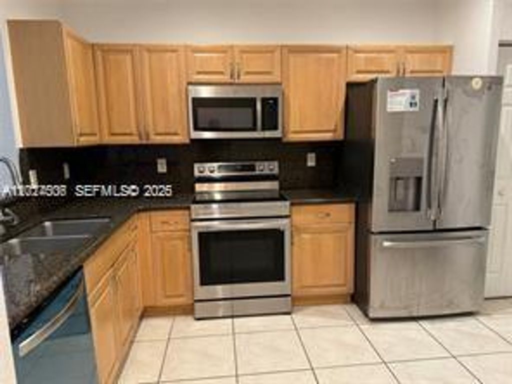Photo of 3907 Tree Top Dr #3907, Weston, FL 33332 (MLS # A12024506)