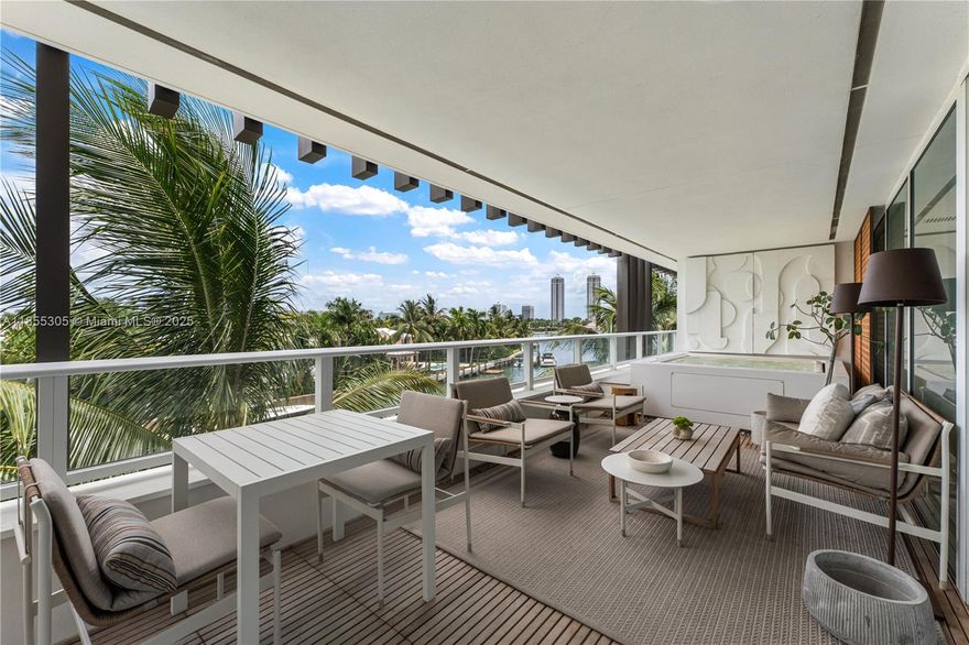 Discover refined waterfront living at The Ritz Carlton Residences Miami Beach, designed by acclaimed Italian architect Piero Lissoni. This 3-bedroom, 3.5-bath, 2,896 SF corner residence captures sweeping views from Surprise Lake to Biscayne Bay, enjoyed best from the private jacuzzi on its expansive  terrace. The home features automated shades, a custom-built bar with wine storage, & interiors by Decor Adore Design. The open Boffi kitchen with Gaggenau appliances flows seamlessly into spacious living areas, while the primary suite offers a spa-like bath with a rain shower & jetted soaking tub. Exclusive Ritz Carlton amenities include a half-acre rooftop pool, private art studio, theater, children’s playroom, and full-service waterfront restaurant, complemented by Ritz Carlton service.