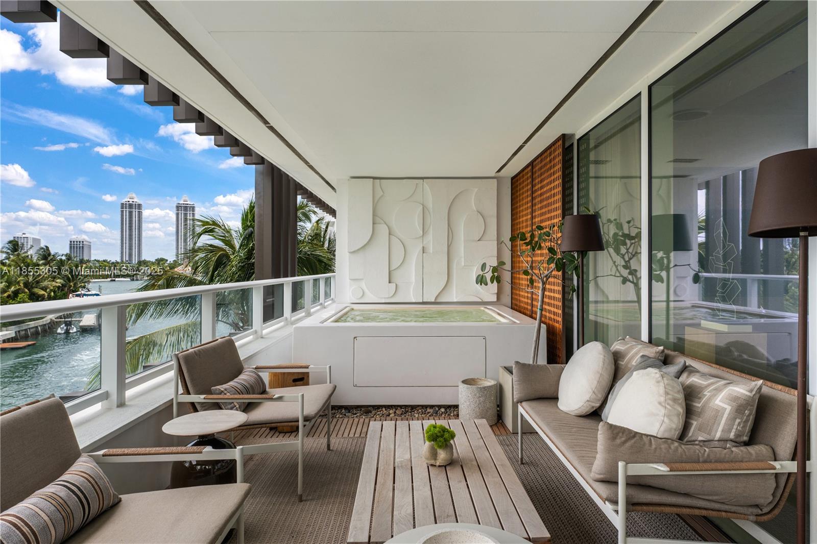 Discover refined waterfront living at The Ritz Carlton Residences Miami Beach, designed by acclaimed Italian architect Piero Lissoni. This 3-bedroom, 3.5-bath, 2,896 SF corner residence captures sweeping views from Surprise Lake to Biscayne Bay, enjoyed best from the private jacuzzi on its expansive terrace. The home features automated shades, a custom-built bar with wine storage, & interiors by Decor Adore Design. The open Boffi kitchen with Gaggenau appliances flows seamlessly into spacious living areas, while the primary suite offers a spa-like bath with a rain shower & jetted soaking tub. Exclusive Ritz Carlton amenities include a half-acre rooftop pool, private art studio, theater, children’s playroom, and full-service waterfront restaurant, complemented by Ritz Carlton service.