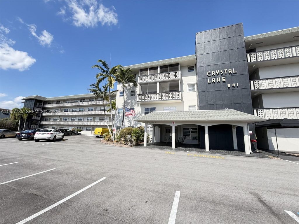 Photo of 941 Crystal Lake Dr #305, Deerfield Beach, FL 33064 (MLS # A11967785)