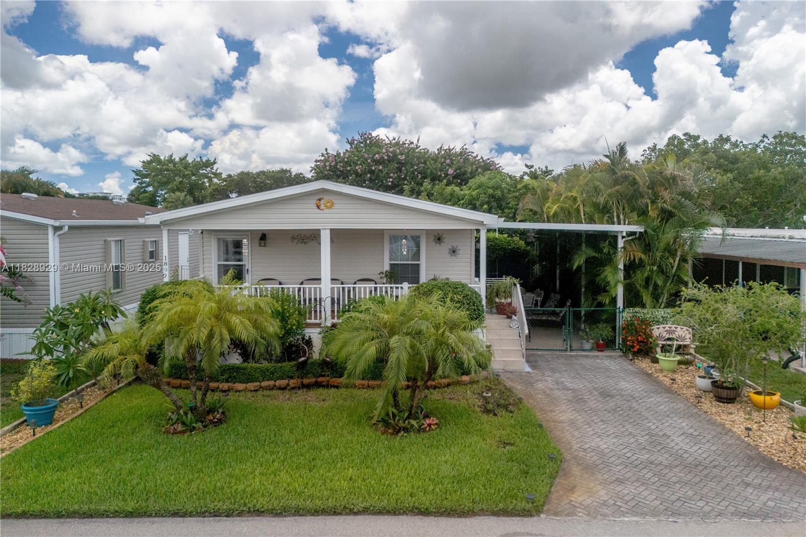 Welcome to this charming 55+ community! This 2020 double-wide manufactured home features an open covered porch and patio, perfect for relaxing and entertaining. Inside, you’ll find beautiful ceramic tile flooring throughout. The entire property is fenced in, offering privacy and security. Don’t miss out on this lovely home in a vibrant community!”