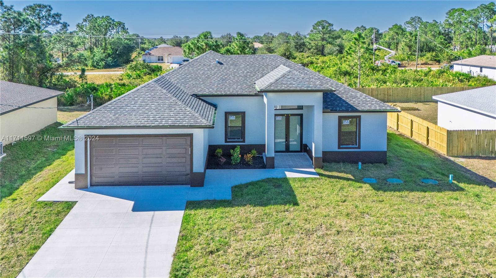 NEW CONSTRUCTION*** Must See***Beautiful 4 bedrooms, 2 bathrooms, new construction home located in a fast growing area of Lehigh Acres. This home has an open floor plan, high ceilings, porcelain tile floors throughout the entire home, 2 car garage, stainless steel appliances, impact windows and doors. Master bath has tiled shower, his & hers closets and sinks. Beautiful white cabinets and quartz counter tops. Schedule your showing today and come see this beautiful​​‌​​​​‌​‌​​​‌‌​​​‌‌‌​​‌​​‌‌​​​​ home!