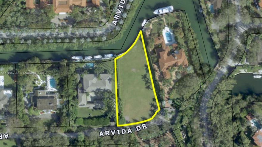 Empty lot with approved permits in the prestigious Gables Estates community.This expansive 43,200-square-foot lot boasts over 150 feet of breathtaking waterfront, offering unobstructed access to the shimmering Biscayne Bay. A boater’s paradise, this parcel presents an unparalleled opportunity to craft the home of your dreams in one of Florida’s most exclusive enclaves. All city PERMITS APPROVED READY TO START CONSTRUCTION.
