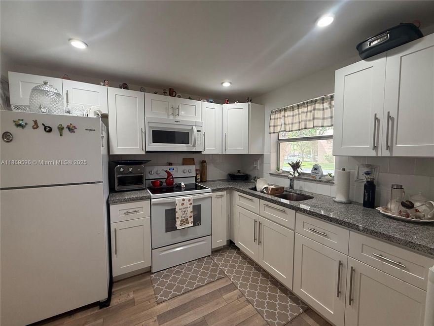 Beautiful corner unit  1/1/.5 condo in this 55+ community  with many upgrades , waterproof flooring, Shaker cabinets and granite counter tops this move in ready condo boast of many ammeneties like Golf, Heated pool, Jacuzzi, tennis court, billiard, BBQ, Cabanas, Theater, pickle ball,gym, comedy shows, parties, and so much more to enjoy the resort life you have been looking for.