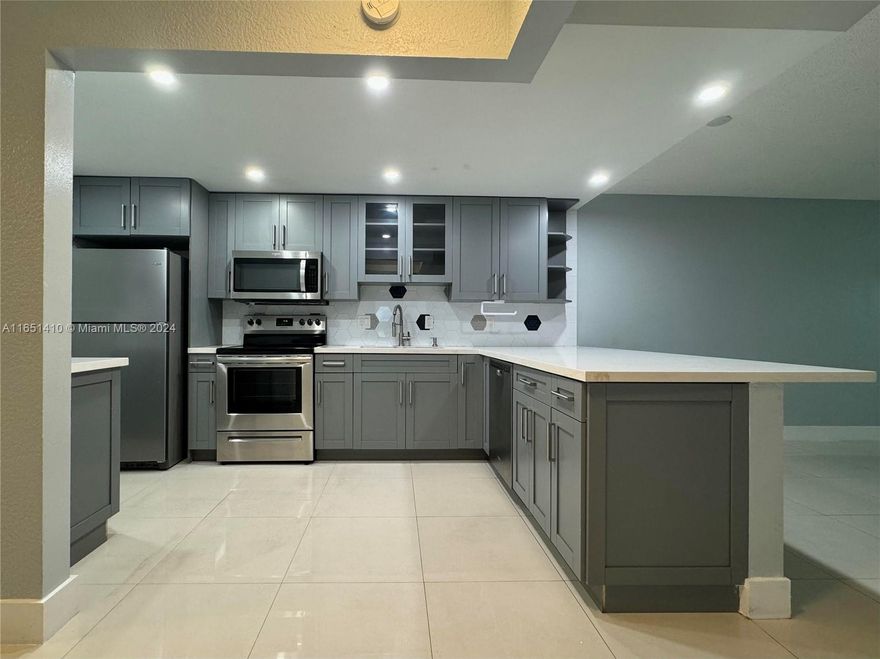 Amazing ground floor corner unit in a great location. Remodeled kitchen with quartz countertops. Tile floor through out the unit. Bathrooms updated. Closed porch with hurricane windows as all the apartment. Two community pools, one temperate. Laundry room with washer and dryer. Clubhouse, gym, tennis courts and more.