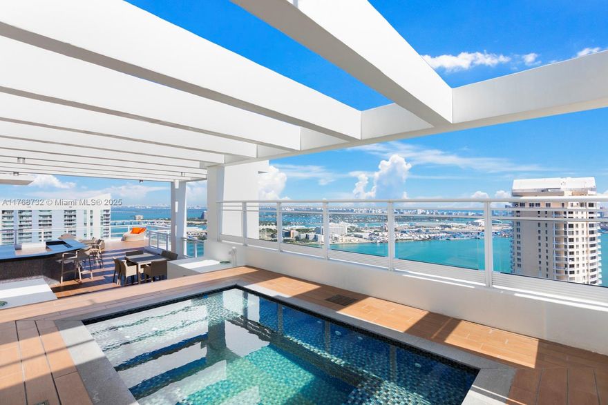 Welcome to the pinnacle of luxury living at Penthouse #3403 in Asia, the most exclusive building on Brickell Key. This fully reimagined residence is a true masterpiece of design and sophistication, offering unparalleled waterfront and city views of Miami, with sweeping panoramas of the bay, ocean, and river. Upon entry, you are greeted by a breathtaking two-sided mirrored waterfall, setting the tone for the elegance and tranquility that define this exceptional home. The penthouse also features a music studio, perfect for creative pursuits, and is adorned with hand-painted walls throughout, beautifully harmonizing with the building’s refined Asian-inspired aesthetic. The second boasts a spacious outdoor deck overlooking the bay, featuring a built-in kitchen and custom jacuzzi.