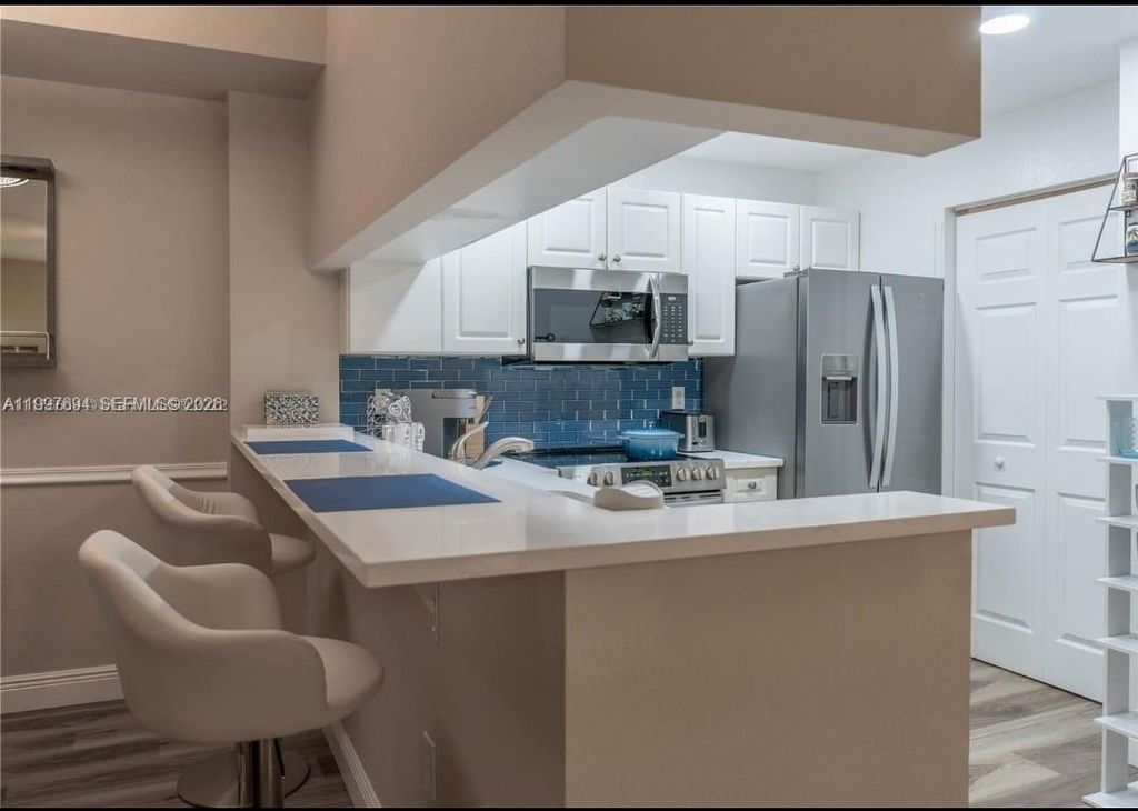 Photo of 2916 Tuscany Ct #201, Palm Beach Gardens, FL 33410 (MLS # A11997694)