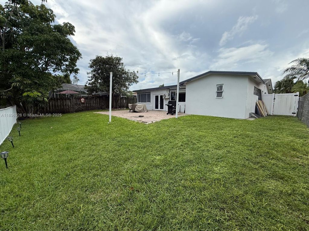 Photo of 8600 NW 27th Pl, Sunrise, FL 33322 (MLS # A11896926)