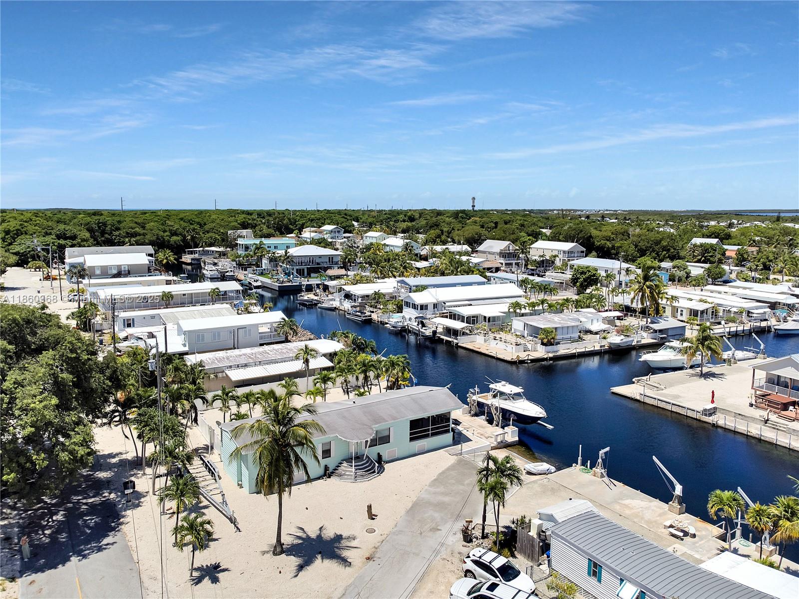 Paradise on main canal with spectacular sunset views. Great location to discover the Florida Keys. Minutes from John Pennekamp Coral Reef State Park, convenient shopping centers, and many restaurants. This charming 2 bed, 2 bath fully furnished home has upgraded living spaces, offering modern comfort and style. Enjoy views from screened terrace and huge patio. Watch the boats drive by from the comfort of your sofa. This home offers comfort and convenience. Available November 1, 2025- March 31, 2026 for a one month minimum.