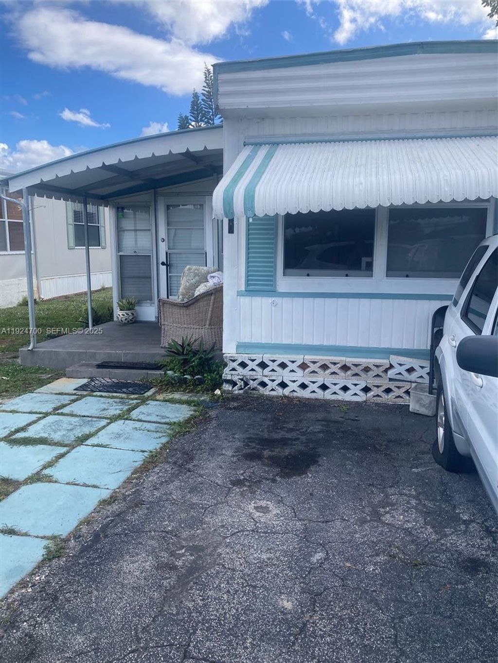 Photo of 310 NE 45 Place, Deerfield Beach, FL 33064 (MLS # A11924700)