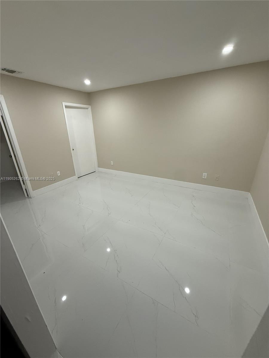 Beautifully remodeled efficiency located in the heart of Hialeah! This charming unit features its own private entrance and fenced yard, offering privacy and independence. The interior has been completely renovated with elegant porcelain tile flooring throughout and a brand-new modern bathroom. Enjoy a bright, open layout with plenty of natural light. Conveniently situated near shopping centers, restaurants, and major highways for easy commuting. Perfect for a single professional or couple seeking a peaceful and well-maintained space. Water and electricity included. Move-in ready!