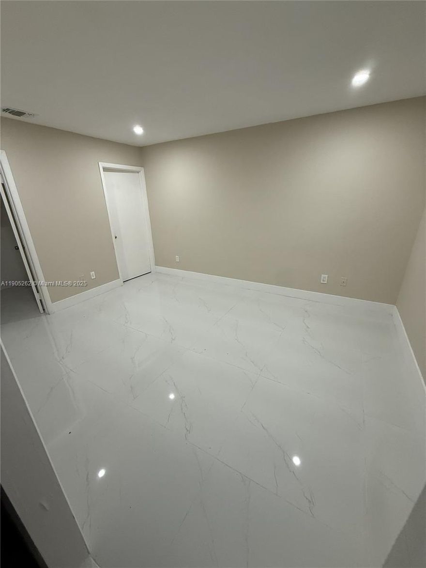 Beautifully remodeled efficiency located in the heart of Hialeah! This charming unit features its own private entrance and fenced yard, offering privacy and independence. The interior has been completely renovated with elegant porcelain tile flooring throughout and a brand-new modern bathroom. Enjoy a bright, open layout with plenty of natural light. Conveniently situated near shopping centers, restaurants, and major highways for easy commuting. Perfect for a single professional or couple seeking a peaceful and well-maintained space. Water and electricity included. Move-in ready!