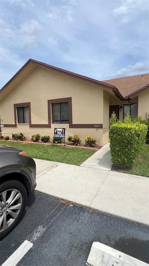 Photo of 11065 NW 38th Pl, Sunrise, FL 33351 (MLS # A12018385)