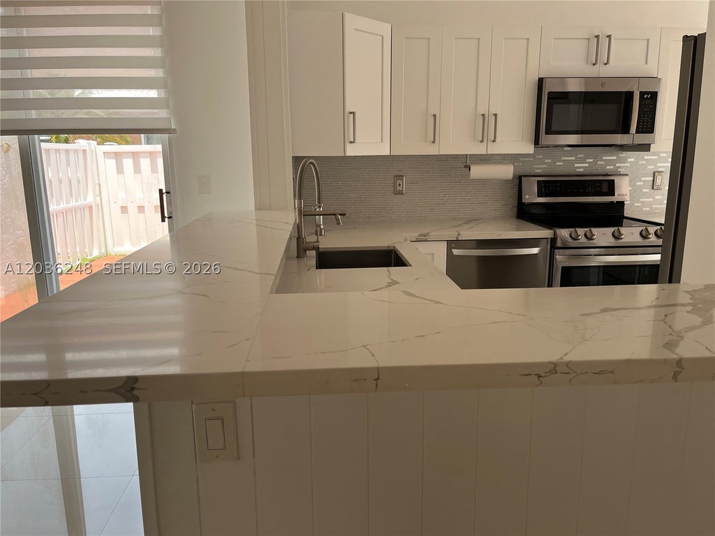Photo of 15112 NW 8th St #77, Pembroke Pines, FL 33028 (MLS # A12036248)