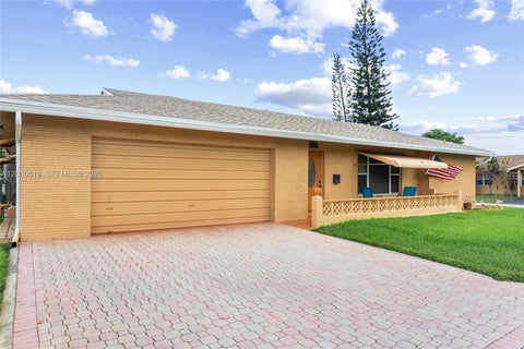 Photo of 7617 NW 66th Ter, Tamarac, FL 33321 (MLS # A12030619)