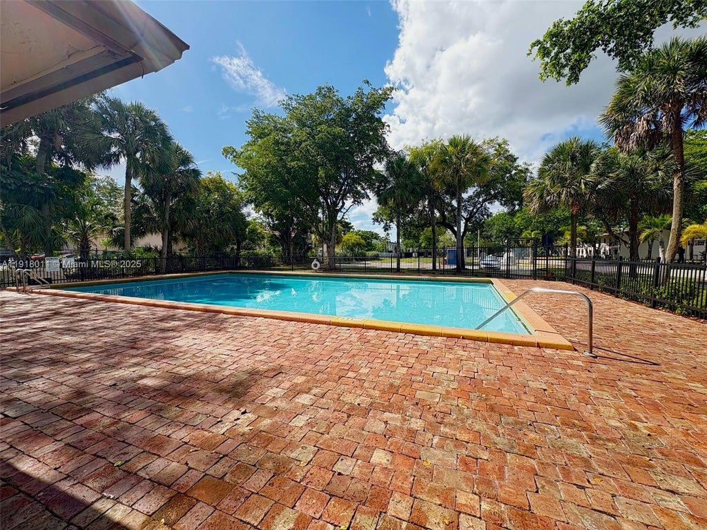 Photo of 4022 Lakeside Dr #4022, Tamarac, FL 33319 (MLS # A11918011)