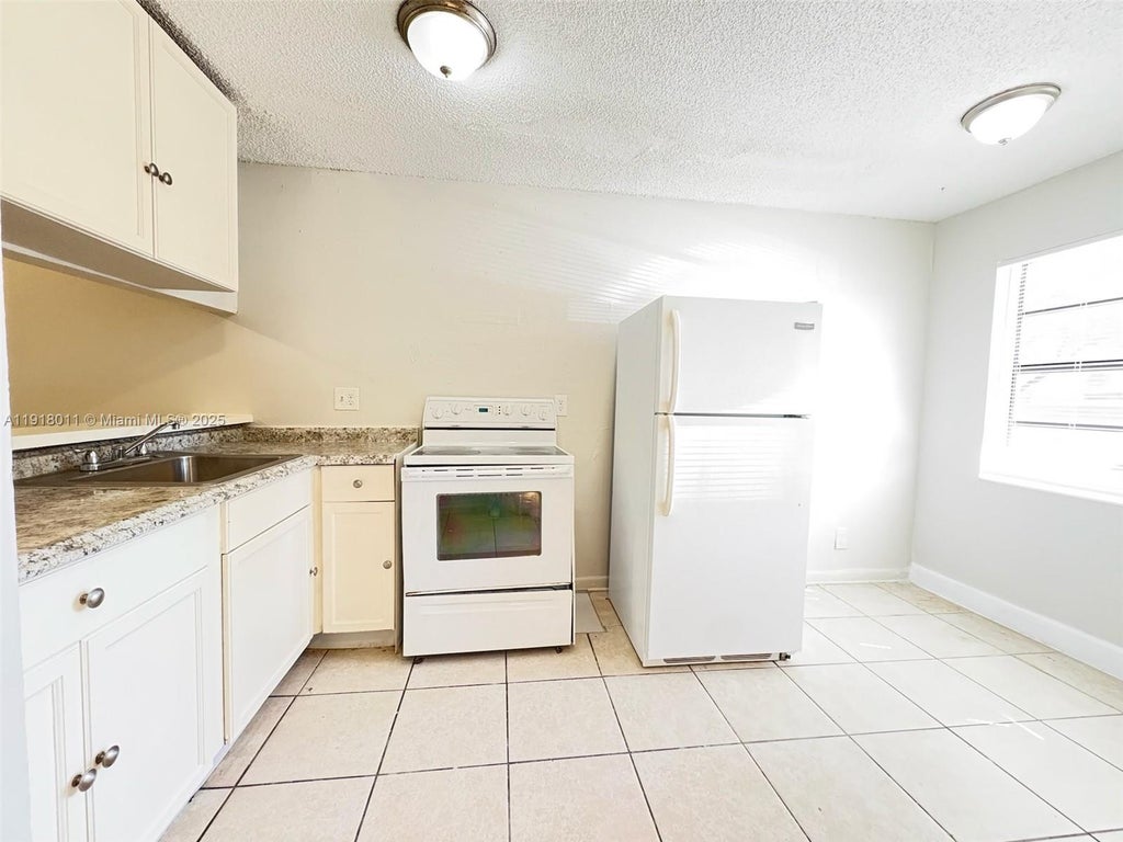 Photo of 4022 Lakeside Dr #4022, Tamarac, FL 33319 (MLS # A11918011)