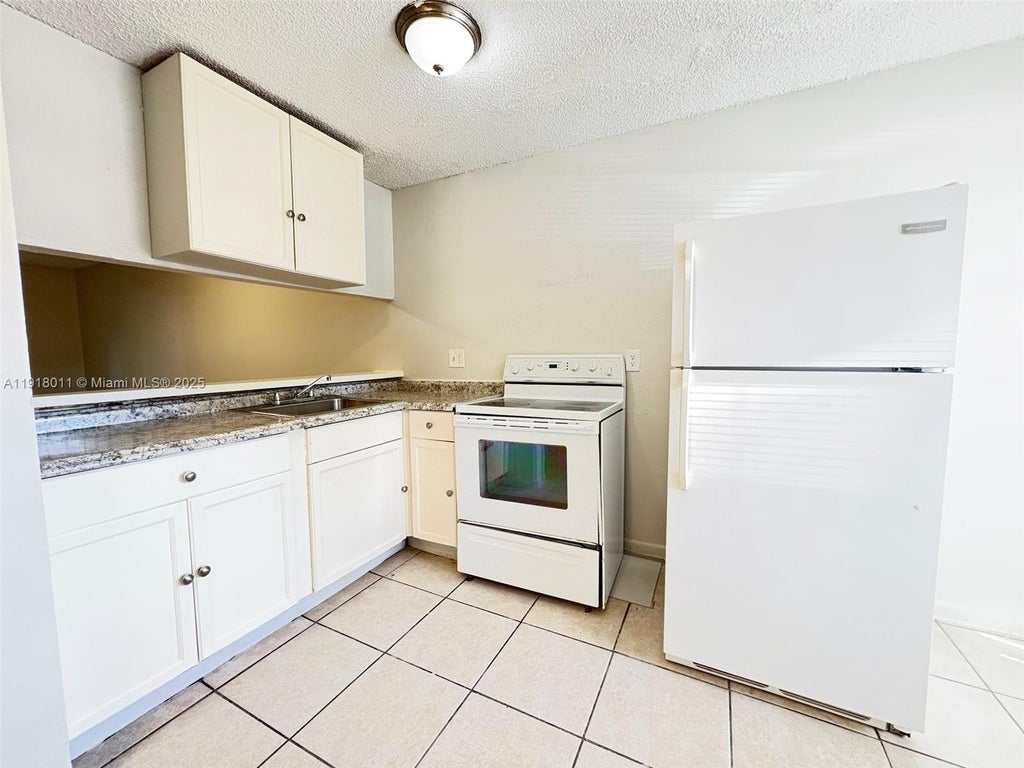 Photo of 4022 Lakeside Dr #4022, Tamarac, FL 33319 (MLS # A11918011)