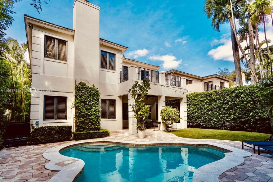 This stunning 5-bedroom, 5.5-bathroom home offers luxurious living just a short walk from Coconut Grove’s vibrant town center. Set on a peaceful, tree-lined street, it features soaring ceilings, elegant wood details, and travertine marble floors throughout. The chef’s kitchen, equipped with Viking appliances, is perfect for culinary enthusiasts. The expansive Master Suite is a serene retreat, while a versatile 1BR/1BA guest suite can serve as an office or guest space. Enjoy a resort-style pool, tropical oasis, and peace of mind with a full-home generator and new impact doors. Walk to shops, restaurants, parks, and more, with Brickell, Coral Gables, and Wynwood just minutes away.