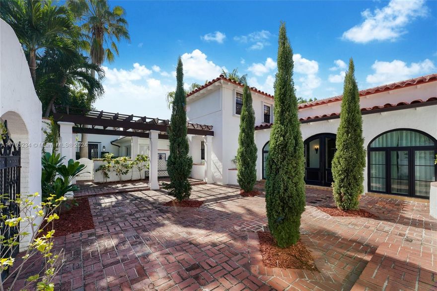 Don’t miss your opportunity to own this hidden gem of a grand Spanish Mediterranean home. Located in the prestigious neighborhood of Pine Tree Drive and La Gorse Country Club, Miami Beach.  Step into the gated courtyard with built-in seating and pergola that feels like you have been taken to a Mediterranean villa. The home features an impressive foyer with charming details; ceilings, tiles, built-ins and window frames. This home features 4 bedrooms and 4.5 bathrooms all en-suite. The main living room has 20’ vaulted ceilings, a decoctive fireplace and grand staircase. The kitchen has been totally redone with a 6-burner gas stove, beautiful counter tops and stainless-steel appliances. In addition, there is a one car garage and a small dipping pool.