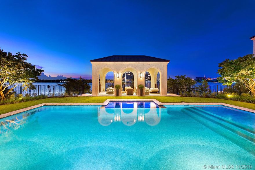 Luxurious contemporary modern waterfront home custom built by Todd Michael Glaser on gated Allison Island. Florida keystone façade surrounds this lavish home with 9,312 square feet under air, on a 26,380 sq. ft. lot with 209 ft. of prime water frontage. 8 bedrooms, 8 full bathrooms, 3 half bathrooms. Includes copper seam roof, 4 car garage, full gym with sauna and massage room. Grand master bedroom with exquisite etched marble bathroom. Private dock, heated swimming pool, outdoor BBQ, formal dining, gourmet chef kitchen. Three fire places. Private and gated Allison Island with neighboring sports stars and CEO’s.