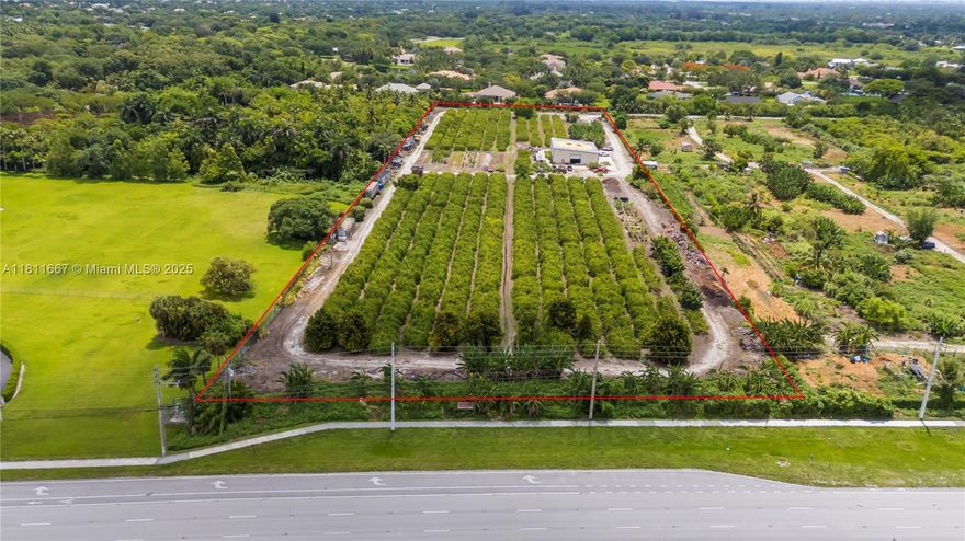 8.9 Acres!! Unique property in Davie surrounded by million-dollar homes in a fast-growing, family-friendly area with "A" rated schools. Fronts Flamingo Rd, backs Flamingo Gardens, and borders the gated Ridge at Laurel Oaks. Fully fenced with gated access. Operating tropical fruit grove since 1987 with ~1,000 starfruit trees and other varieties (macadamia, avocado, banana, etc.). Features include a 5" well, advanced irrigation, and a 4,800 sf insulated steel building (Cat 5+ rated) with 1,140 sf A/C space, 2 kitchens, 2 baths, and 3 offices. Industrial features: mezzanine, 800A power, racking, security system. Includes prepped 1-acre homesite for a 4,000 sf home. Ideal for family compound, agribusiness, or investment. Agriculturally assessed, very low taxes.