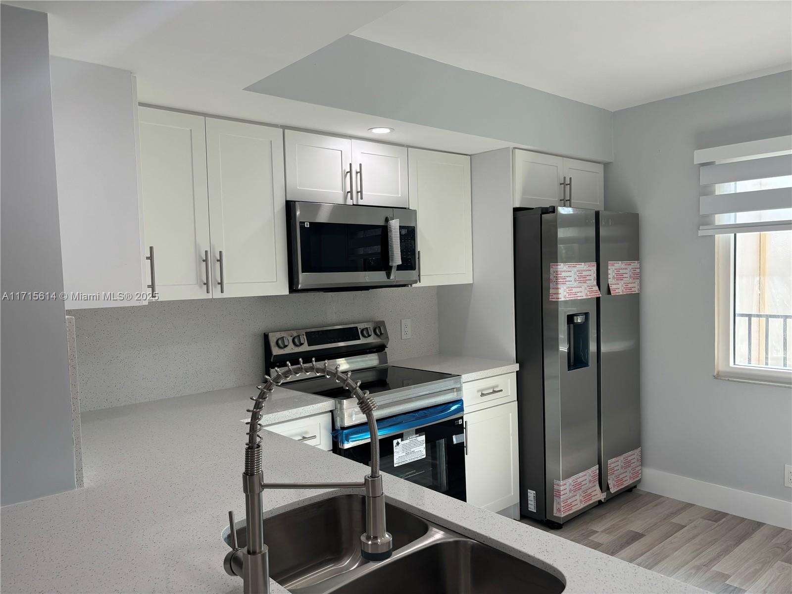 Fully remodeled 1/1.5 condo in the heart of Pembroke Pines. This beautiful and spacious unit features brand new kitchen cabinets w/SS appliances & quartz countertop. Tastefully renovated bathroom with shower. Also, all new flooring throughout, freshly painted, recess lighting, Hurricane impact window and NO POPCORN ceiling. Private balcony overlooking gorgeous Golf Course and laguna. Washer/Dryer inside unit and newer A/C. Unit has 1 assigned parking & plenty of guest parking. HOA includes water, cable, internet, and endless amenities. Million-dollar clubhouse, gyms, pools, theater, transportation and much more. Excellent location, near major shopping malls, restaurants and major highways