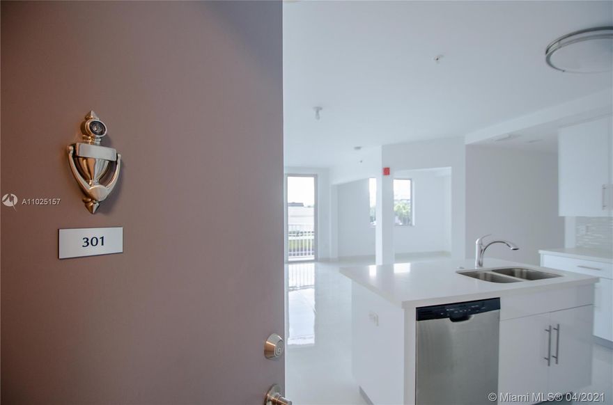 Beautiful corner unit!! secured building w/elevator. Great location. Luxury Italian kitchen w/wood cabinetry, island, quartz counters & S.S. appliances open to dining & living area. 2 BEDS, 2 BATHS + DEN with window that can be office/playroom/3rd bedroom. Porcelain white tile throughout. Open floor plan w/balcony. Natural lighting. High impact windows & doors. Aventura Waterways K-8 Center public "A" rated school. W/D in unit. 2 assigned parking. Water,cable,alarm included. Community pool.