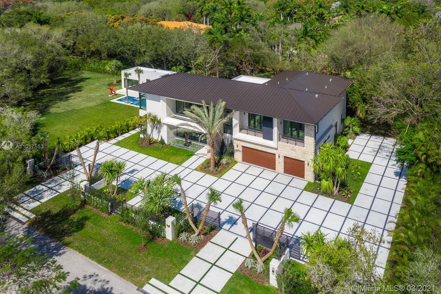 Furnished, Rich Decorated, and turn Key, Situated on a magnificent Cool de Sac Lot, The Mansion 6775 at Pinecrest is a Luxurious home with contemporary Bali Architecture, Custom Luxury Mansion Build by Devtov. Located at the north of the city, next to the most prestigious schools. 2 Story home with an accessory building, 6 bedrooms, and 6.5 bathrooms in the Main house, additionally 2 bedrooms and two bathrooms in the Guest House. Long Lap Pool with Jacuzzi, Expansive Covered Summer Kitchen, Lush Landscape, and Tanning Pool Deck. Your family and loved ones will enjoy the spacious backyard, perfect for family gatherings!