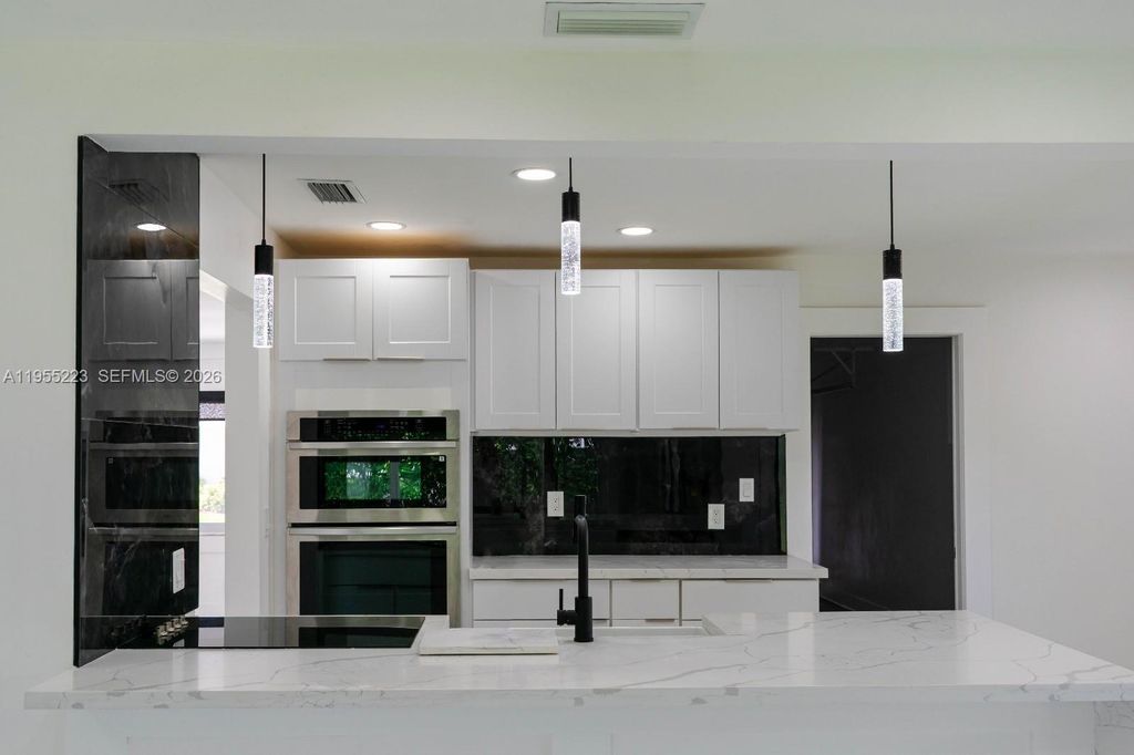 Photo of 1009 Leisure Ln, Boynton Beach, FL 33426 (MLS # A11955223)