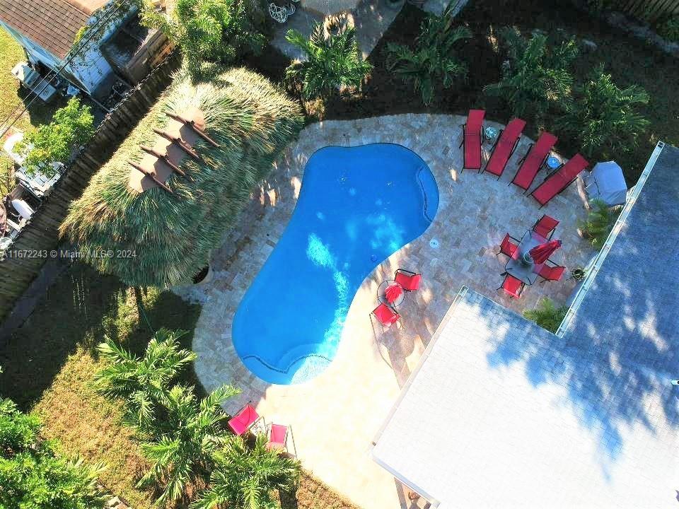 Welcome home to this well-appointed starter house with impact windows throughout, in the heart of Fort Lauderdale. Offering a beautiful backyard oasis with a free form pool including a water feature, travertine pool deck, tiki hut, cedar shed and covered boat parking... great for entertaining. Kitchen updated with new appliances that includes a wine cooler in 2022. Excellent location just minutes from the beach, Ft. Lauderdale airport, Port Everglades and many shops and restaurants.