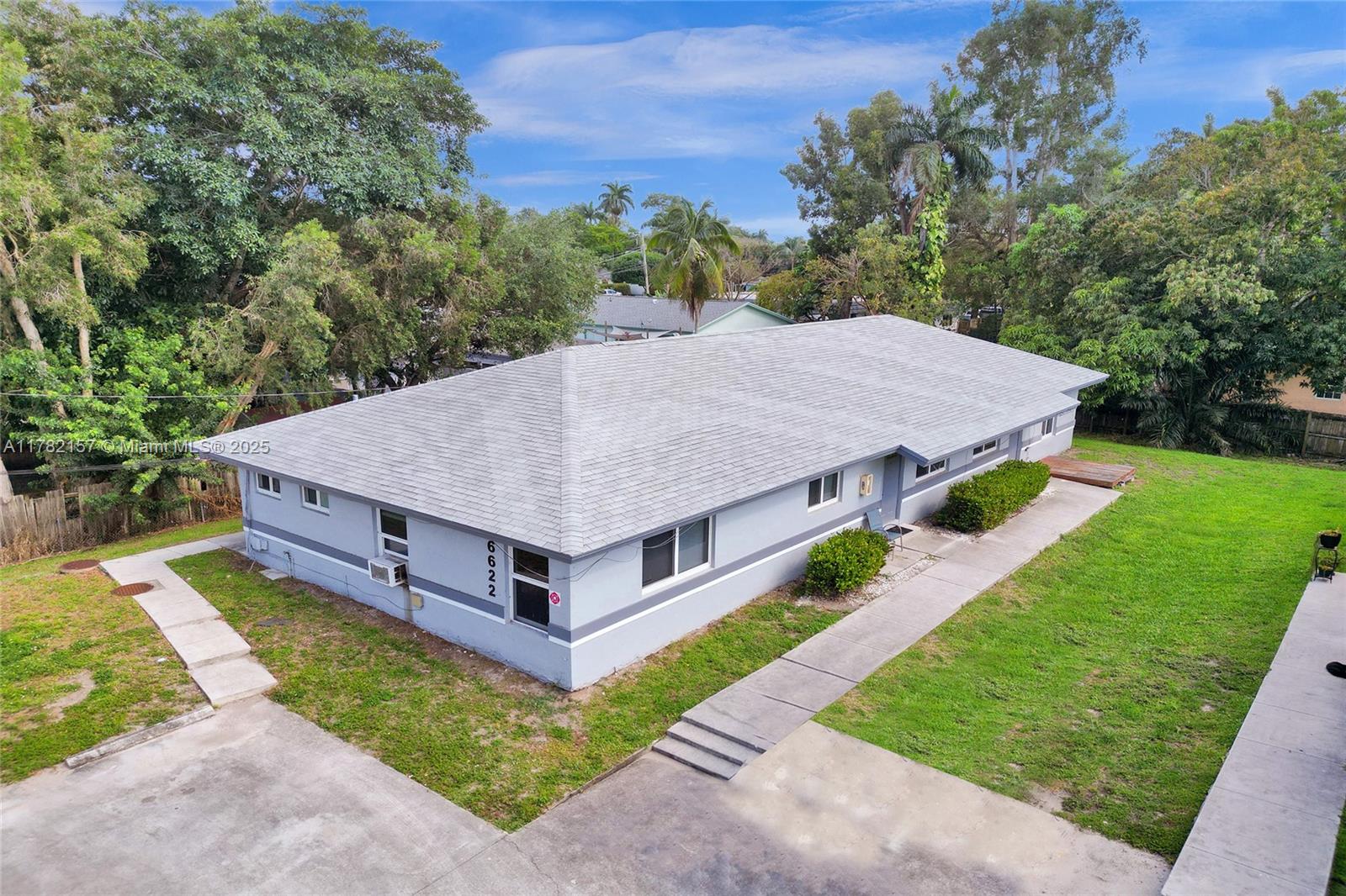 EXCELLENT OPPORTUNITY FOR INVESTORS!! This is a spacious and COMPLETELY UPDATED duplex with extra studio is in a prime location, near universities, shopping, Seminole Hard Rock Hotel and highways. NEW ROOF AND IMPACT WINDOWS ALL AROUND - 2022. Each unit has UPDATED KITCHENS with QUARTZ COUNTERTOPS and NEWER APPLIANCES within the last 3 years, UPDATED BATHS, TANKLESS WATER HEATERS, and TILE THROUGHOUT each unit. Both 2-bedroom units have NEWER A/C SYSTEMS, and the studio has a wall A/C unit. Shared coin operated LAUNDRY ROOM with security lock. 4 parking spaces. Being sold simultaneously with the building next door, which has the same floorplan/layout - MLS # A11782159