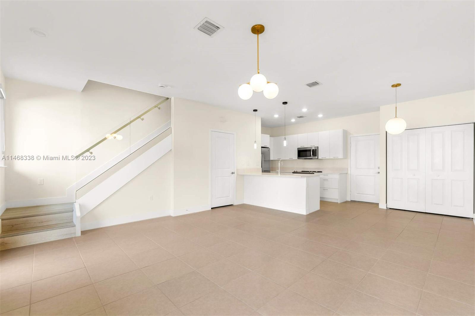 Modern resort-style townhouse in the heart of sought-after downtown Doral. It has been exquisitely upgraded with California closets and panty, black-out blinds, and modern light fixtures, all of which are included. This home features three bedrooms, two full bathrooms, a half bath, and a two-car attached garage. 1,963 square-feet including the garage and covered balcony. You'll also enjoy access to the best Doral schools, as well as convenient proximity to airports, shops, restaurants, and sports facilities. This is the perfect opportunity to experience a luxurious lifestyle in the heart of Doral.