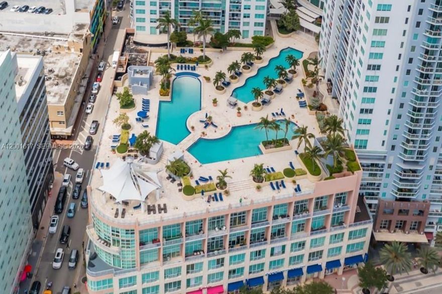 THIS IS THE LARGEST 1 BEDROOM FOR SALE! ALL ASSESSMENTS PAID! MOVE-IN READY.  This large 1006 SF Corner 1 bedroom / 2 bathrooms + home office/den/guest room apartment has a New Kitchen, New Floors, New Washer/Dryer and a Sonos surround sound system. The Primary Bedroom is very big and fits a king-size bed. It’s also a corner with 2 large windows so it is bright and sunny all day long. There is a custom designed walk-in closet and a private bathroom with a window. There’s a separate home office/den/guest room and a 2nd full bathroom. The floors are new with a natural white-wood designed finish.  This unit comes with 1 garage spot and a private storage unit.  Vizcayne South’s lobby welcomes you with 24/7 concierge and security staff. Enjoy many amenities including a 15,000-sq-ft gym & spa complete with massage rooms, sauna, and steam rooms, as well as three stunning lagoon pools with a bar overlooking the bay—and much more. Vizcayne is currently undergoing building updates and all the assessments have been paid by the owner. Easy To Show. Call today!