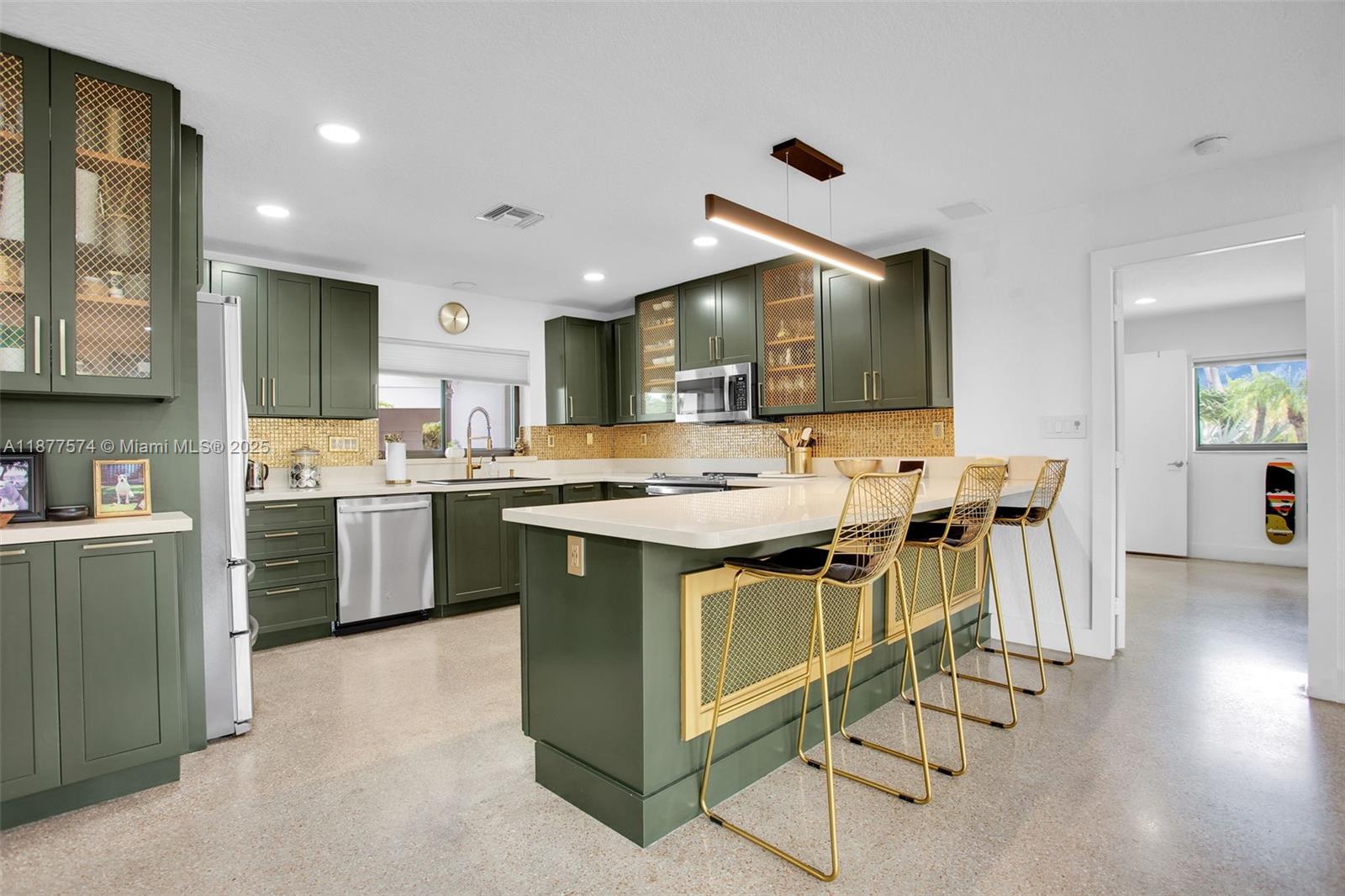 Set at the end of a private cul-de-sac, this renovated 3BR/3BA single-story home sits on a coveted point-lot with 135 ft. of wraparound waterfront, Offering serene views and exceptional privacy amid lush tropical landscaping. Inside, a bright open layout showcases polished terrazzo floors, a chef’s kitchen with custom olive cabinetry, quartz countertops, stainless appliances & gold accents, plus a spacious primary suite with spa-style bath and walk-in closet. The outdoor is a true entertainer’s paradise with a pool & spa, firepit lounge, expansive patio, and custom deck overlooking wide water vistas. A new black tile roof is being installed this week.. Ideally located near Wilton Drive, dining, shopping & Ft.Lauderdale Beach. In one of South Florida’s most sought-after neighborhoods.