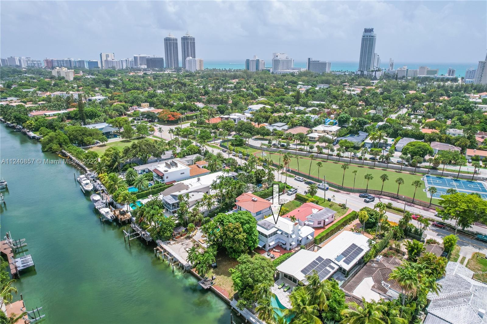 We are so excited to finally be able to show this property** Take advantage of this amazing opportunity to renovate/build the home of your dreams on this mega-size 10,000+ sqft lot w/approx 56 ft' of prime waterfront w/ocean access. Expansive yard w/space for a grand pool & a dock for your watercraft. There are currently 2 structures on this lot, the main 4/3 house is 2 levels w/a gorgeous centerpiece spiral staircase (a sound structure with a newer roof) and the second structure is a spacious 2/2 cottage (ideal to draw income while renovating one and renting the other). Live in the most sought-after neighborhood of Miami Beach, just minutes away from top-rated schools, parks, restaurants, shops, and near highways. LEAST EXPENSIVE WATERFRONT LISTING in the area. Easy to show! Call today!