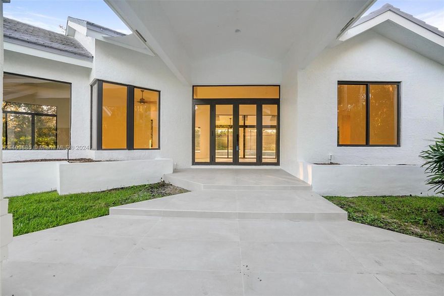 Presenting an exceptional residence nestled on an elevated 1.6 acre lot in the prestigious guard gated community of Windmill Ranch Estates. The updated kitchen and cabinetry has been installed as shown in the renderings. Some additional notable features include impact glass (windows, doors and garage) throughout, tankless water heater, whole house water softener, oversized pool screen enclosure, a 600 square foot lanai with a built-in BBQ area and more. The lush landscaping provides privacy and an oasis feel to the property.  This home boasts 4 bedrooms, 4 bath and 3,017 sq. ft.