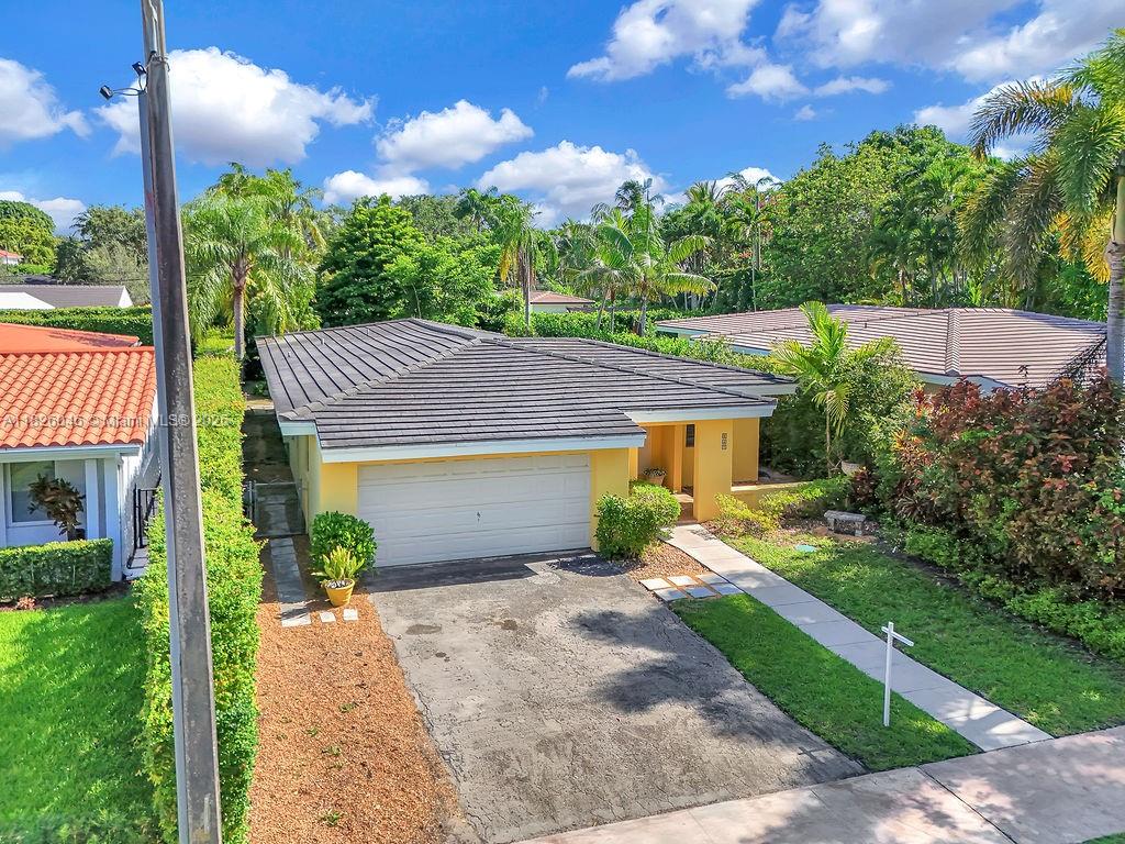Nestled in a prime Coral Gables location south of US-1, just minutes from Merrick Park, Starbucks, top supermarkets, and only 20 minutes from the airport, this 3-bed, 3-bath home offers solid construction, high ceilings, and great potential. While mostly in original condition, the roof is only halfway through its lifespan—an excellent plus. The home features large windows, a spacious 2-car garage with a full bath, and a generous driveway. Inside, one of the bedrooms has been opened to create a versatile flex space—perfect for an office or easily converted back. The primary suite boasts two walk-in closets, and the backyard offers plenty of room for a pool. Move-in ready with great bones, this home is an ideal opportunity to live or invest in Coral Gables.