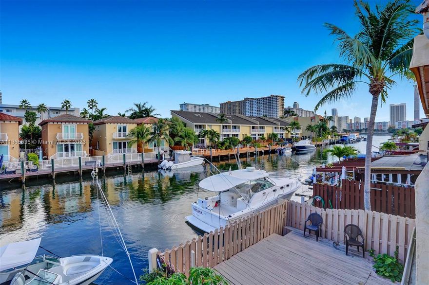 Waterfront Townhome situated in Eastern Shores, boasting 2 beds and 2 1/2 baths. The home also features an additional bedroom on the lower level that can serve as an office, guest room, or bedroom. The kitchen is designed with an open layout that flows seamlessly into the living and dining room areas. This unit is in pristine condition and offers a picturesque view of the canal. Dockage is also available with ocean access, and there are no fixed bridges to the ocean. Eastern Shores is a well-located area, within walking distance to the beach, stores, restaurants, supermarkets, the iPic movie theatre, and Oleta Park.  24-hour guard gate. A bonus for potential buyers is that the owner is including a 17ft Avanti Regal boat currently parked behind the house.