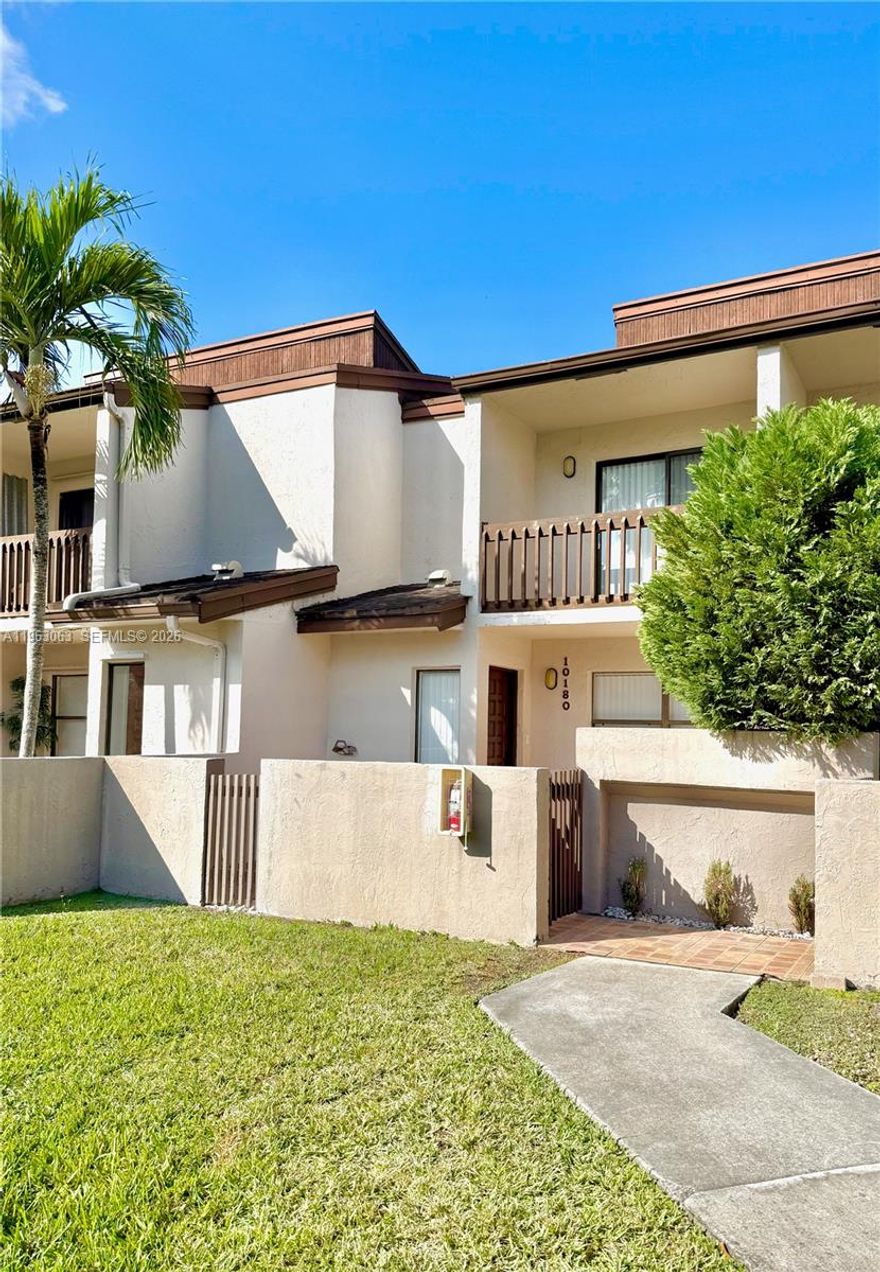 This centrally located Doral townhouse in a gated community is near expressways and conveniences with the privacy of no rear neighbors. The interior features an open layout with natural light, luxury vinyl flooring, and Calacatta quartz in the kitchen and bathrooms. The kitchen is equipped with stainless steel appliances, an eat-in area, and a pantry for extra storage. The floor plan includes a 1/2 bath downstairs, while the two upstairs bedrooms both feature en-suite bathrooms with porcelain tile and a conveniently located new washer and dryer. The master suite includes dual vanities and his-and-hers closets. Outside, the home offers a tiled patio with a storage room, assigned parking space, and guest parking throughout.