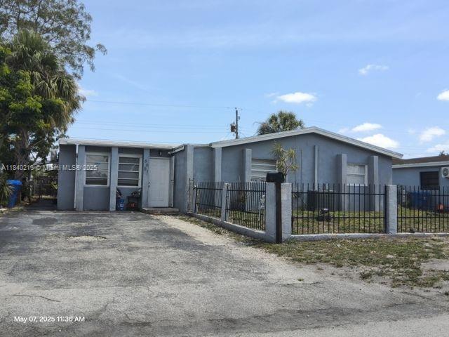 Discover this versatile four-bedroom home in Hollywood, FL! Featuring two attached rental units that generate steady income, this property is perfect for investors or homeowners seeking extra cash flow. The main house offers spacious living areas, modern kitchen, and comfortable bedrooms. Enjoy a large backyard and plenty of parking. Centrally located near shopping, schools, and beaches—ideal for living and earning in one property. Don't miss this incredible opportunity!