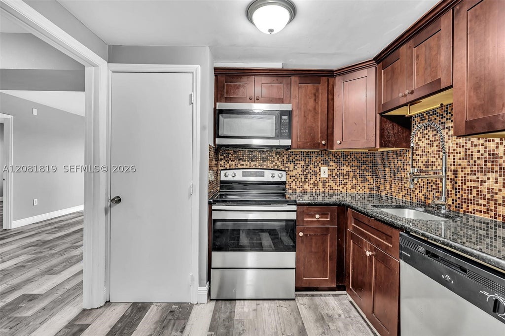 Photo of 4158 Inverrary Dr #503, Lauderhill, FL 33319 (MLS # A12081819)