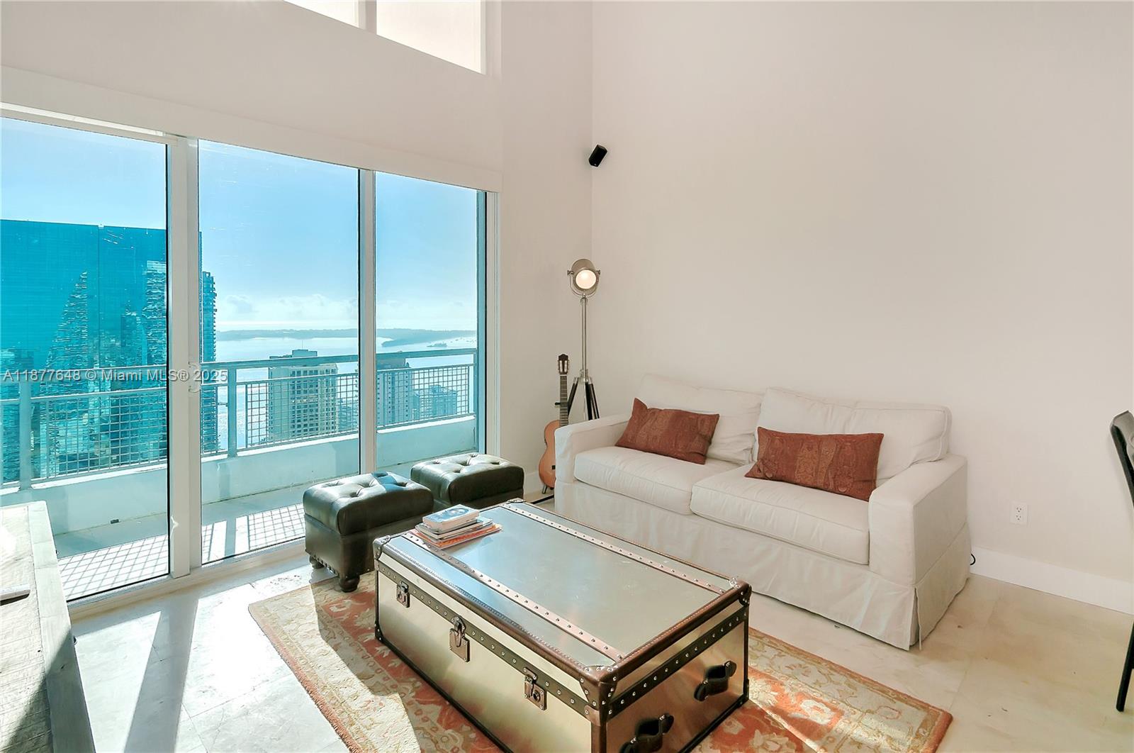 Stylish 2BD/2.5BA loft with soaring double-height ceilings, floor-to-ceiling windows, and private balcony with city views. Features include a modern kitchen with stainless steel appliances and granite countertops. Completely remodeled bathrooms with sleek finishes. Enjoy panoramic city views from your private balcony and world-class amenities including a pool, gym, full-service building and 24/7 security. Prime Brickell location steps to Brickell City Centre, dining, shopping, and transit. Perfect as a residence or investment.
